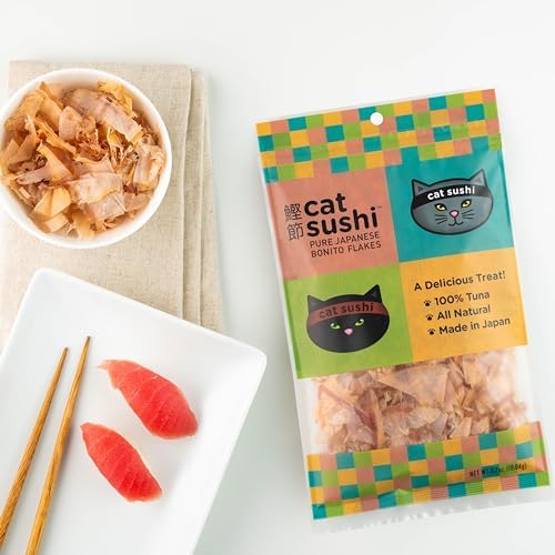 Bowl of Cat Sushi bonito flakes beside tuna nigiri and chopsticks